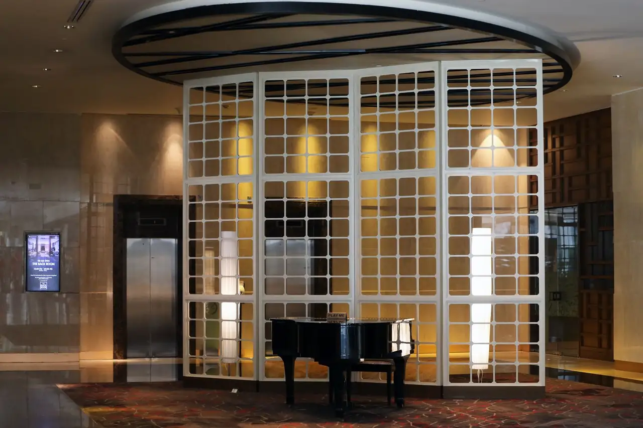 Elegant grand piano in the sophisticated lobby of Delquarian Royal Stay