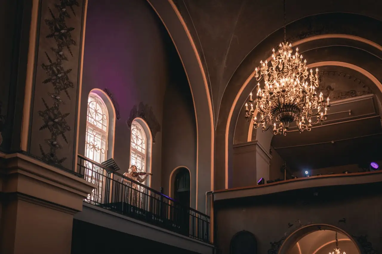 Violin performance under chandelier